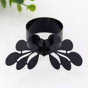 Detail of laser-cut black butterfly napkin ring for wedding and banquet table decor