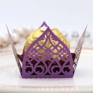 Detail of purple laser-cut lace candy wrapper with floral pattern for chocolate gift box