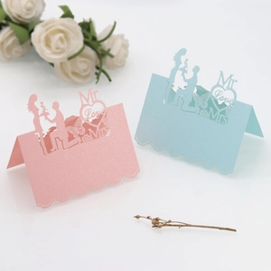 Laser cut wedding place cards with Mr & Mrs silhouettes and elegant butterfly details