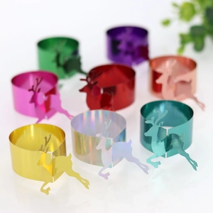 Detailed view of colorful metallic deer napkin rings for Christmas table decoration