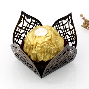 Detailed laser-cut hollow brown chocolate wrapper with intricate vine patterns