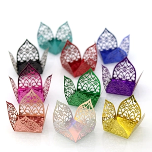 Detail of laser-cut chocolate candy boxes with ornate European hollow patterns in ten colors
