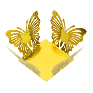 Close-up of golden laser-cut butterfly candy box with intricate hollow lace texture