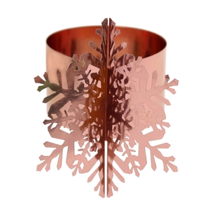 Detailed view of 3D snowflake napkin ring in rose gold finish for festive table setting