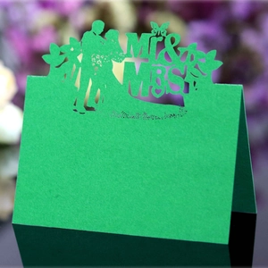 Detailed laser-cut green butterfly wedding place card with hollow Mr & Mrs silhouette