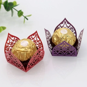 Laser cut hollow paper candy box with intricate lace patterns and floral design