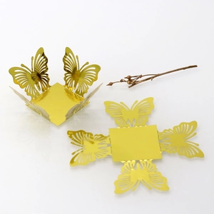 Flat and folded view of golden butterfly laser cut hollow candy box for weddings