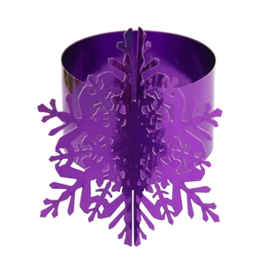 Close-up of a purple metallic snowflake napkin ring with a reflective mirror finish