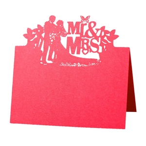 Red laser-cut wedding place card with Mr & Mrs silhouette for elegant table settings