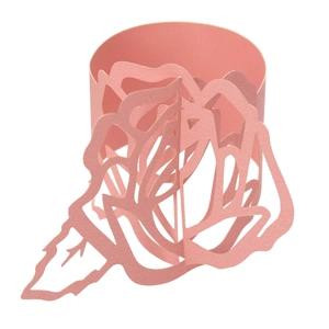Detail of laser-cut paper rose napkin ring in soft pink for elegant table decoration