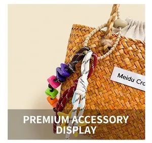 Detail of hand-woven straw bag featuring colorful beads and Meidu Cro fabric label