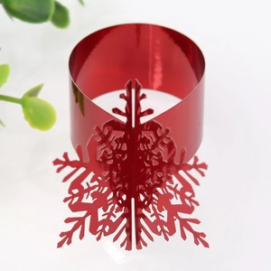 Macro shot of 3D red snowflake napkin ring with metallic finish for Christmas table decor