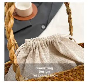 Detail of hand-woven straw bag showing the drawstring linen liner and texture
