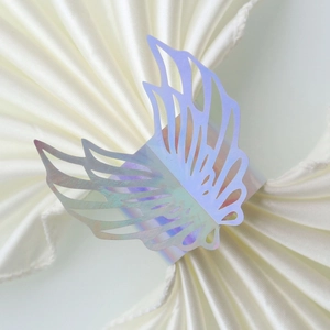 Macro view of holographic butterfly napkin ring with laser-cut hollow wing details