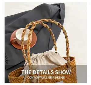 Detail of woven straw handbag featuring reinforced braided handles and cotton drawstring liner
