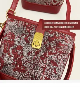 Detail of red Chinese style bucket bag with golden buckle and wave pattern embroidery