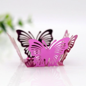 Intricate laser-cut butterfly hollow candy box in vibrant pink with pearlescent finish
