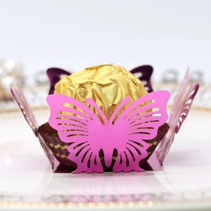 Macro view of hollow butterfly chocolate paper holder in rose pink and purple