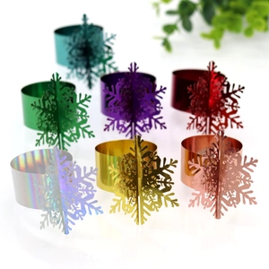 Detailed set of multi-color snowflake napkin rings with metallic finish for holiday tables