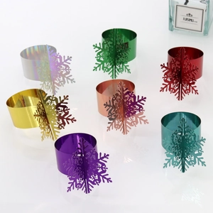 Detailed set of 3D snowflake paper napkin rings in seven shiny metallic mirror colors