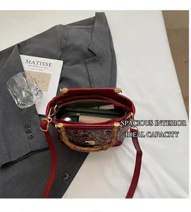 Interior view of red Chinese style jacquard tote bag with bamboo handle and inner pocket