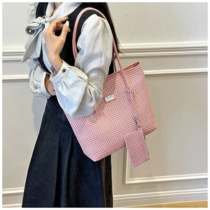 Detail of pink and white chevron woven tote bag with matching small pendant pouch