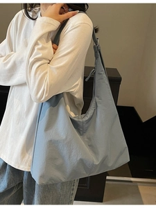 Light blue large capacity tote bag with adjustable strap for casual daily commuting