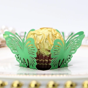 Intricate green laser-cut butterfly cupcake wrapper for wedding party dessert decoration