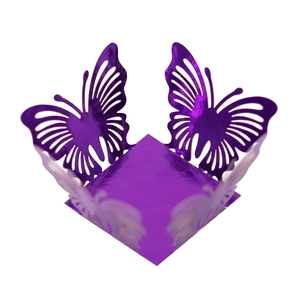 Macro shot of purple hollow laser-cut butterfly decoration with mirror reflective finish