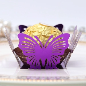 Detailed view of purple laser-cut butterfly chocolate holder for wedding party favors