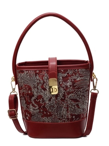 Elegant red bucket bag with floral embroidery and golden metal clasp for women