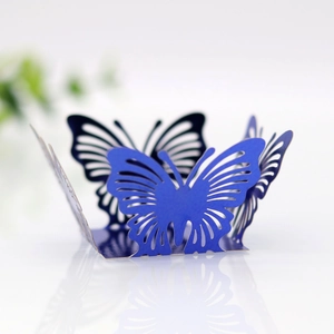Detail of laser-cut hollow butterfly cupcake wrapper in elegant pearlized dark blue cardstock