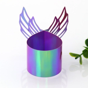 Iridescent laser cut angel wing napkin rings with purple and green gradient effect