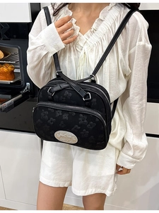 Sac à dos noir en tissu jacquard avec fermetures éclair argentées en mode décontracté