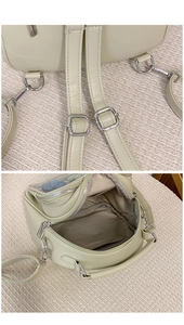 Detail of mint green PU leather backpack with clear window and adjustable silver straps