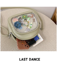 Detail of light green ITA bag with transparent PVC window and adjustable shoulder strap