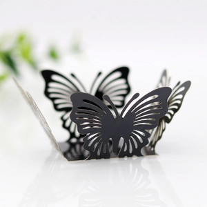 Detailed laser-cut black butterfly decoration with intricate hollow floral patterns