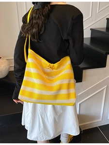 Chic yellow striped mesh tote bag with wooden button and bright shoulder strap