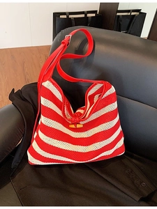 Striped red and white mesh tote bag with leather straps and wooden horn button