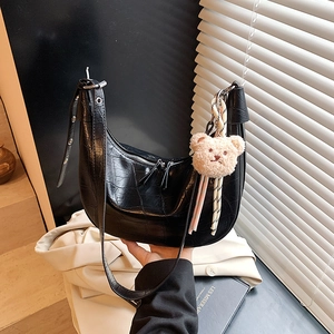 Minimalist black faux crocodile underarm bag for women with a cute teddy bear charm