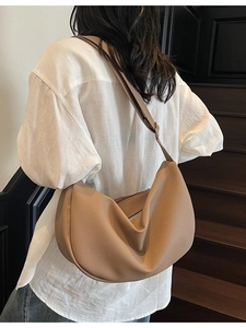 Khaki crescent moon shoulder bag with lychee texture leather on female model