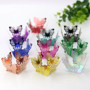 Macro display of laser-cut butterfly candy boxes in various vibrant metallic colors