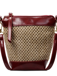 Straw and burgundy leather crossbody bag with adjustable strap and gold metal hardware
