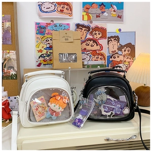 Detailed comparison of black and white mini Ita bags with clear PVC display windows