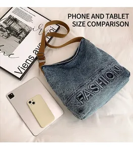 Top view of large capacity denim tote bag with FASHION lettering and tablet for scale