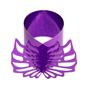 Macro detail of purple holographic angel wings napkin ring with intricate laser cutouts