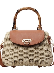 Vintage woven straw bag with bamboo handle and leather crossbody strap for beach vacation