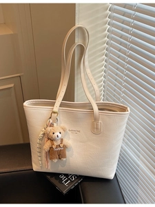White crocodile pattern tote bag with bear charm and fashion lettering on front