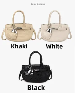 Detailed comparison of textured crescent handbags in khaki, white, and black with heart charms