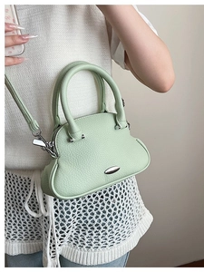 Pistachio green shell bag in pebble grain leather with silver hardware for women